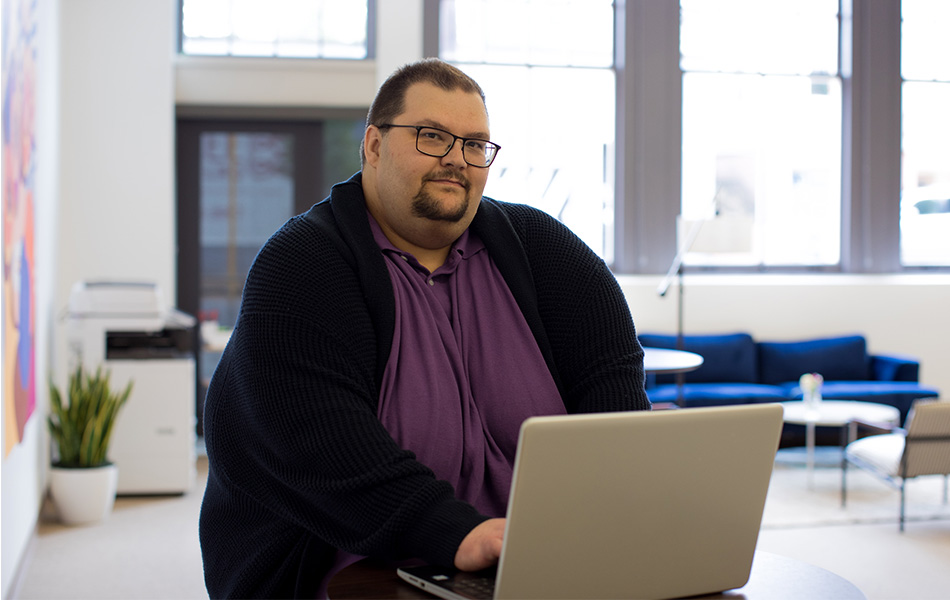 Man sitting with laptop computer